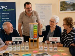 Atelier de prévention santé mentale animé par Jean-Luc Joutz avec un groupe de seniors utilisant le réservoir du bien-être pour illustrer les facteurs de protection et les facteurs de risque.